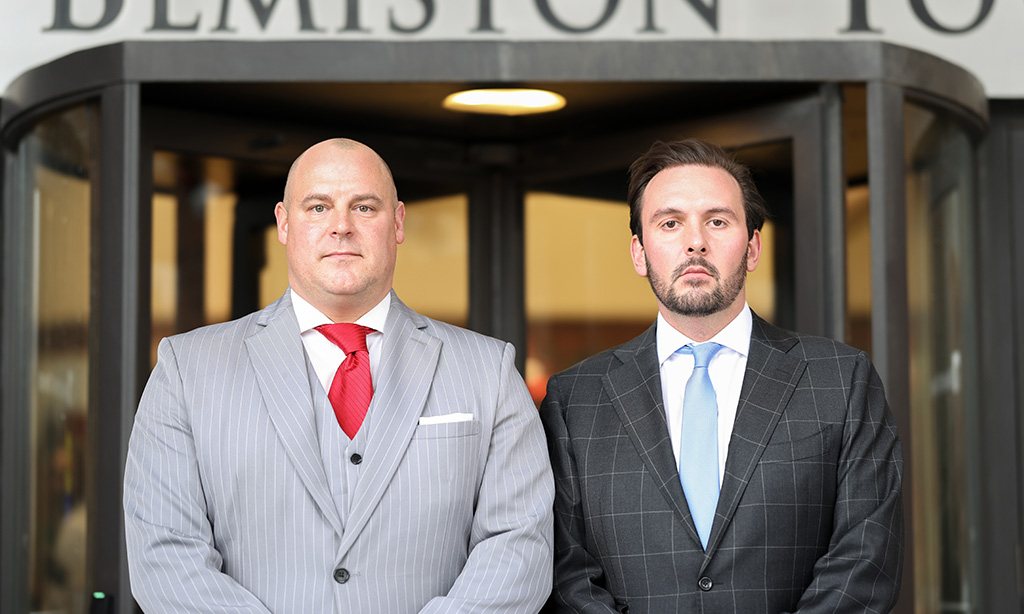 Combs Waterkotte attorneys standing outside a building