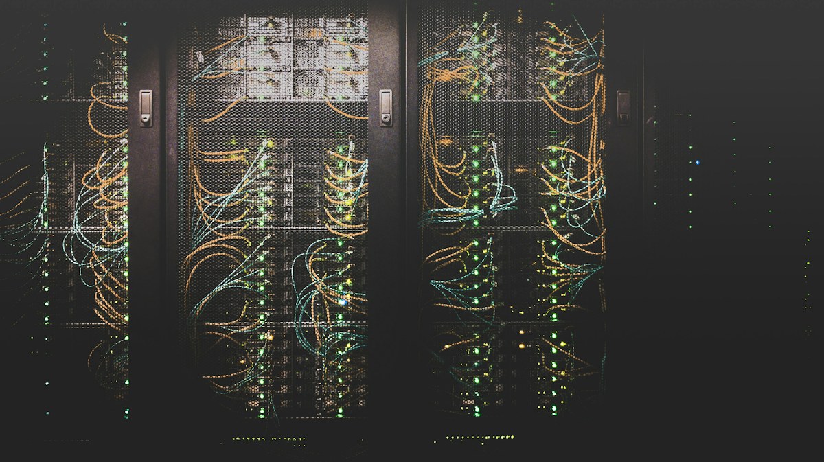 Server racks with network cables and status lights